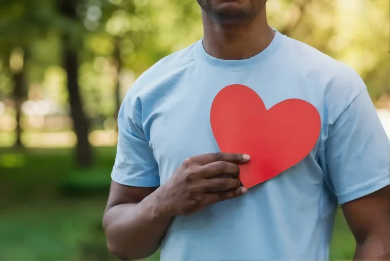 Person holding heart symbol